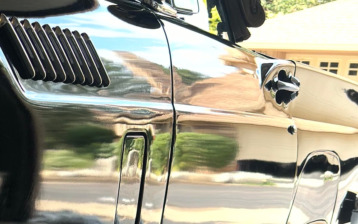 Ceramic-coated black paint reflecting the street like a mirror